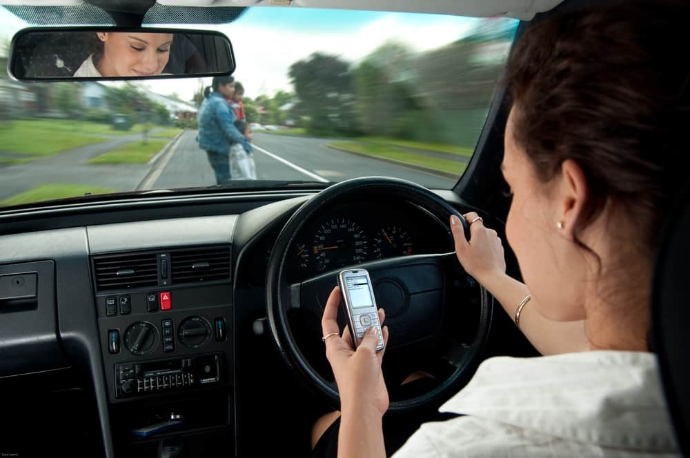 Man texting while driving