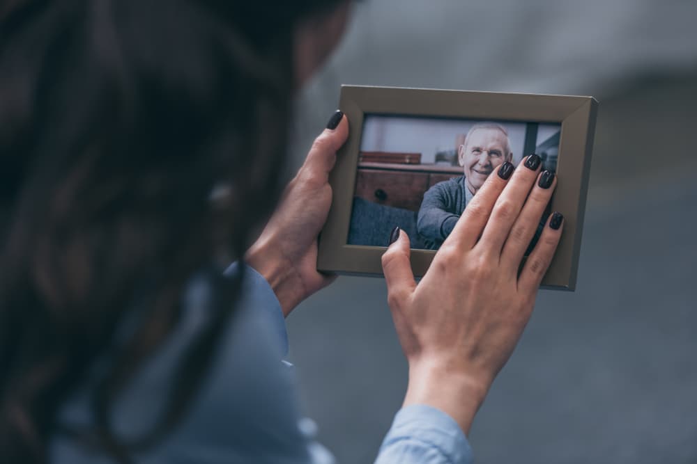 Woman holding a photo frame