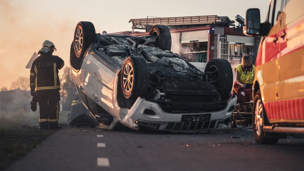 Rollover car accident on road