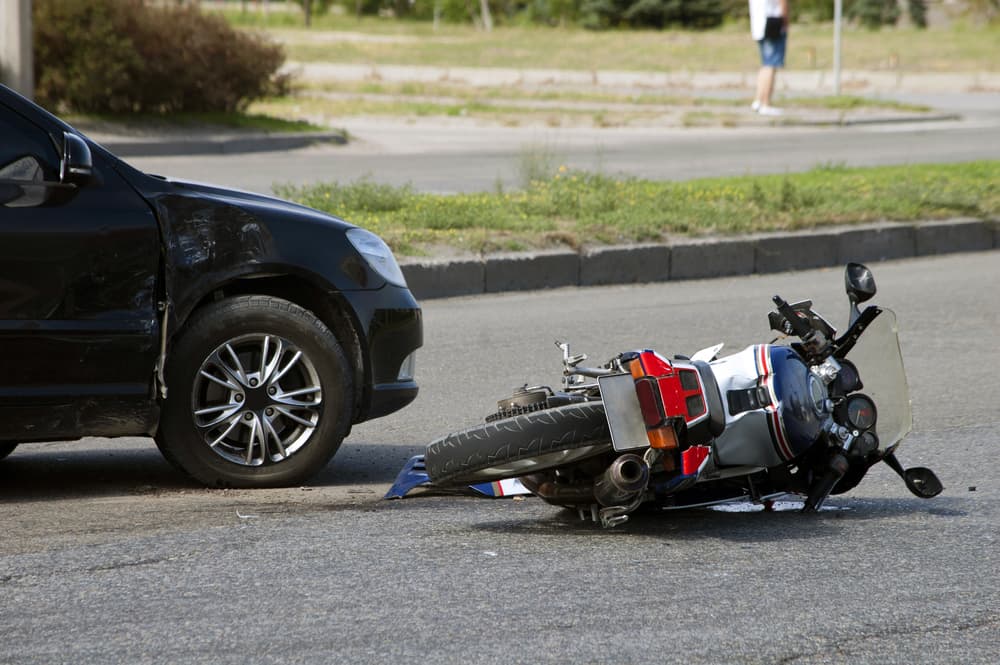 Motorcycle crash on road