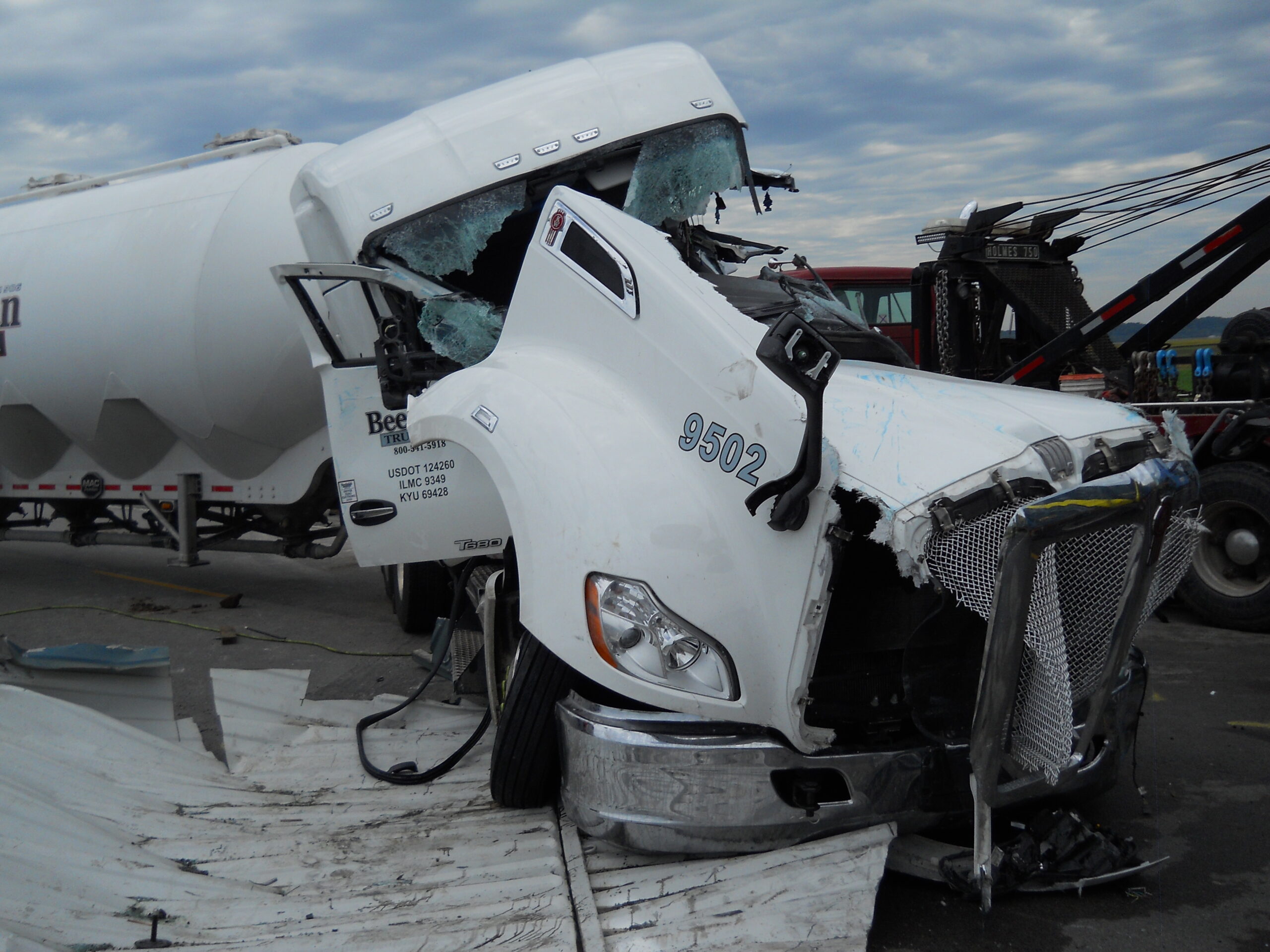 white semi truck front end totaled after accident