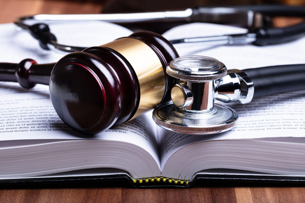 Stethoscope and a gavel on a law book