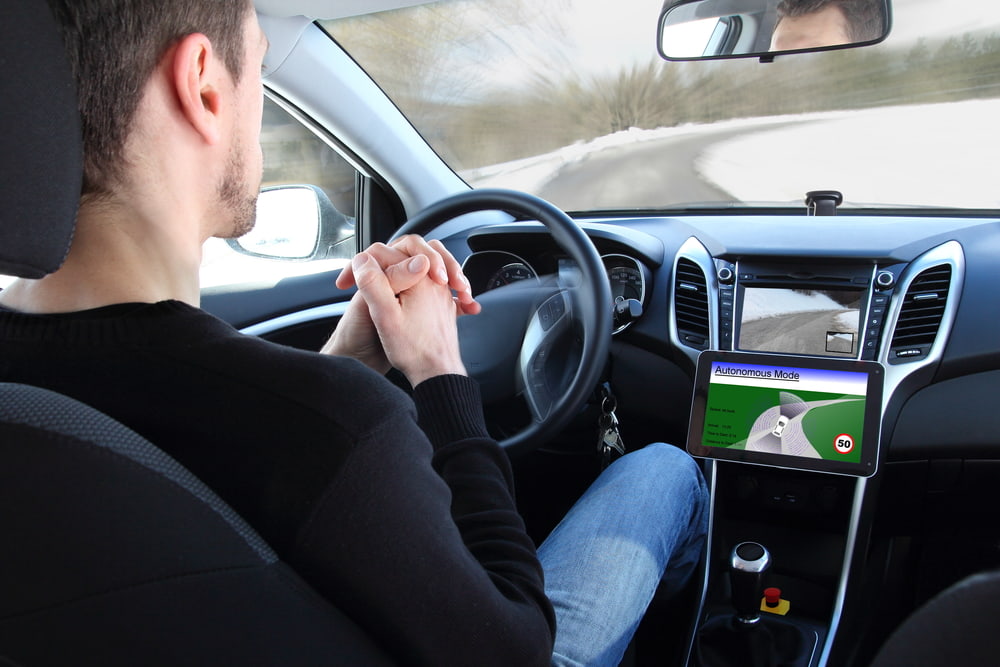 men testing a self-driving car