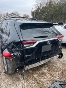rear end damage to black SUV after car crash