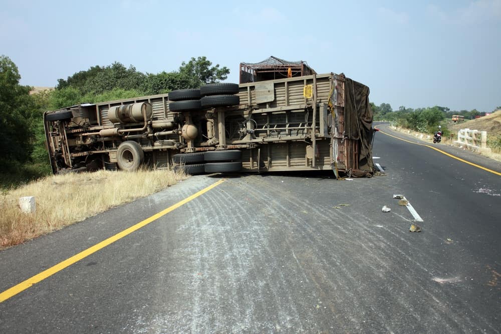 Truck overturned on the road after an accident