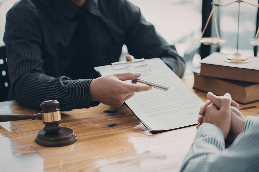 Lawyer and client signing a contract