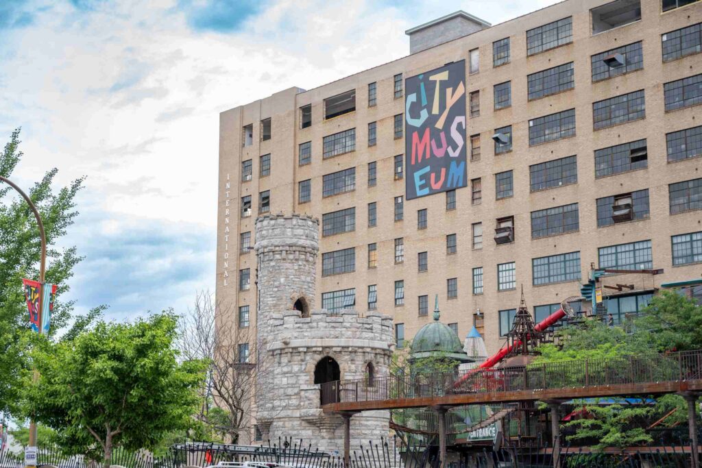 The exterior facade of the City Museum building featuring stone turrets and colorful signage.